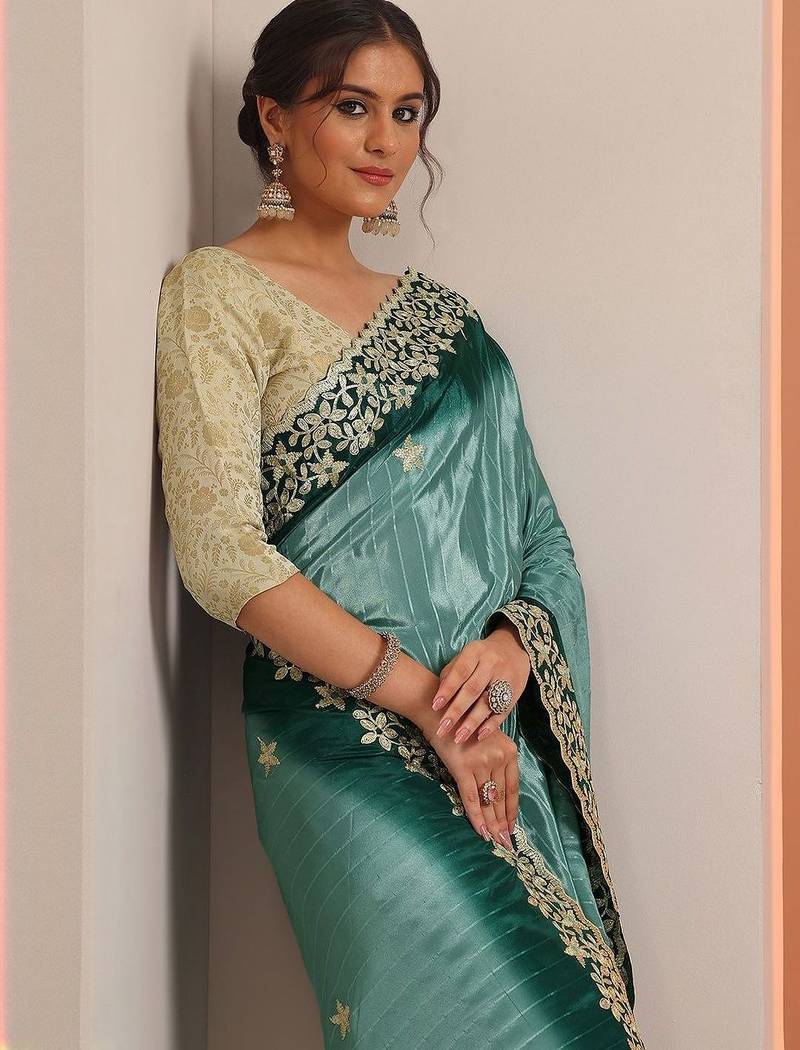 teal embellished crepe saree with unstitched blouse piece