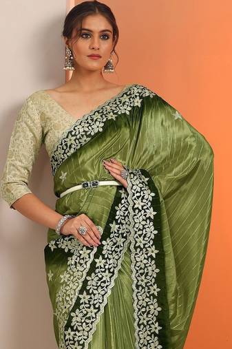 green embellished crepe saree with unstitched blouse piece