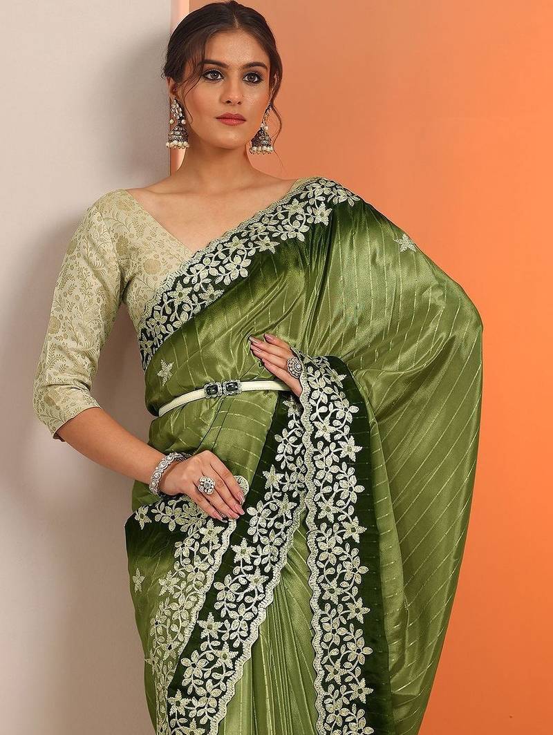 green embellished crepe saree with unstitched blouse piece