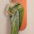 green embellished crepe saree with unstitched blouse piece