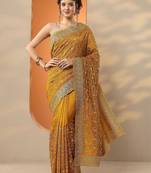 yellow embellished saree with unstitched blouse piece