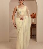 cream tissue saree