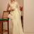 cream tissue saree