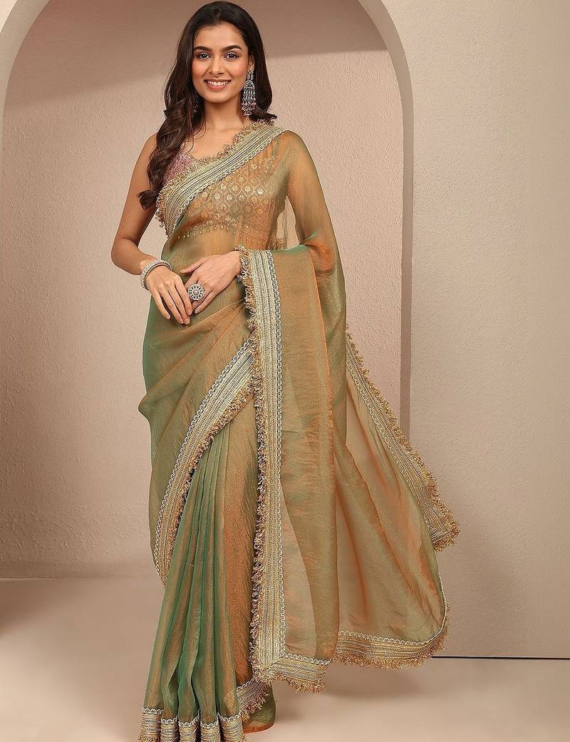 green solid saree with zari taping border and a blouse piece