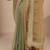 green solid saree with zari taping border and a blouse piece