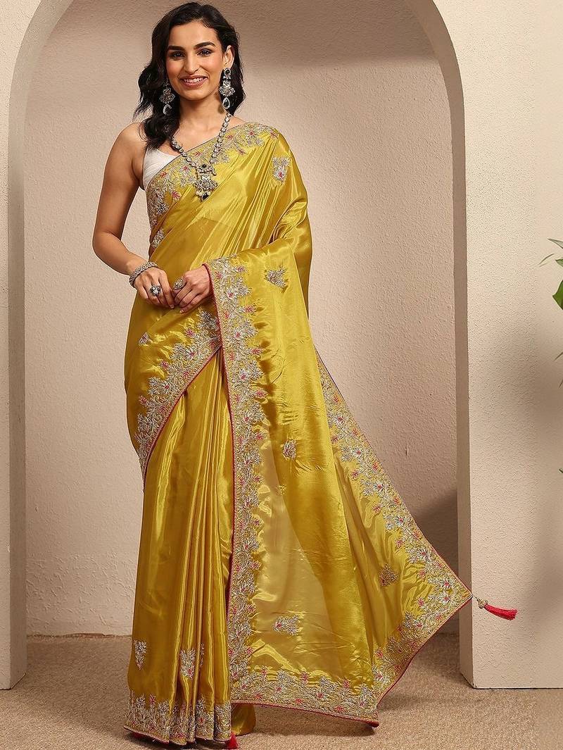 yellow embroidered saree with unstitched blouse piece