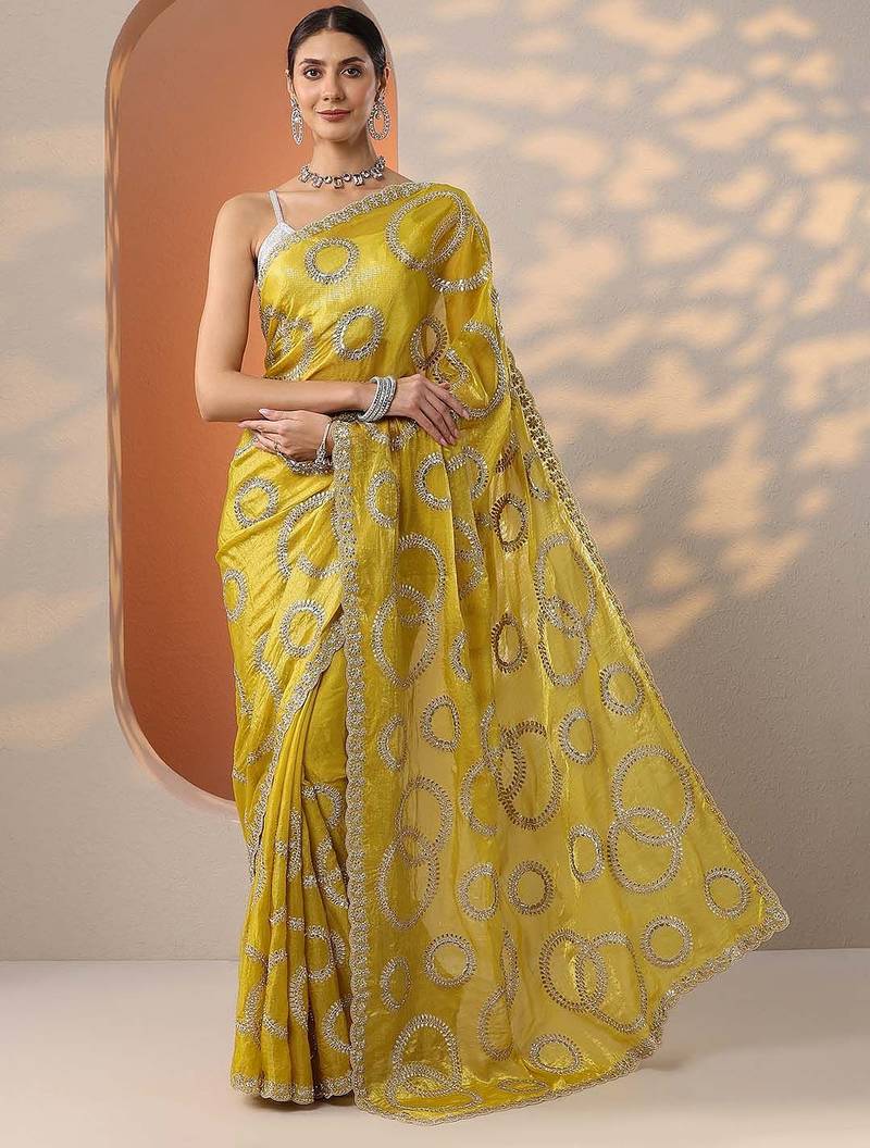 yellow embroidered organza saree with unstitched blouse piece