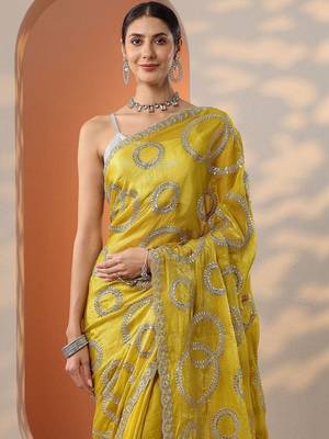yellow embroidered organza saree with unstitched blouse piece 5