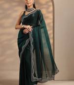 green solid saree with unstitched blouse piece