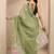 green embellished saree with unstitched blouse piece