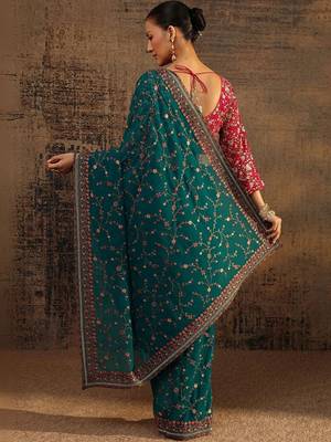 teal floral embroidered net saree 4