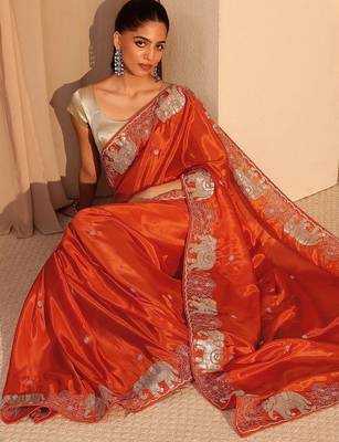 orange embellished satin saree with animal motif border 1