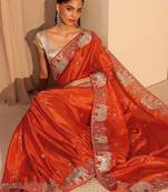 orange embellished satin saree with animal motif border
