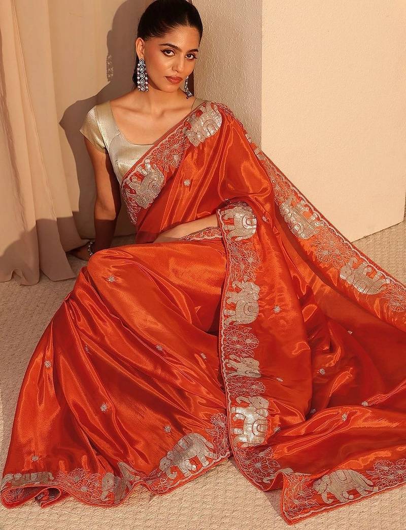 orange embellished satin saree with animal motif border