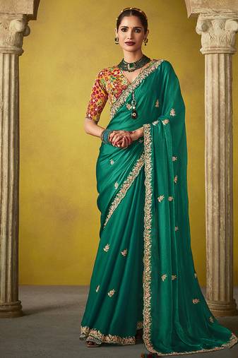 Green pure based fancy fabric embroidery saree