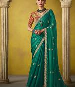 Green pure based fancy fabric embroidery saree