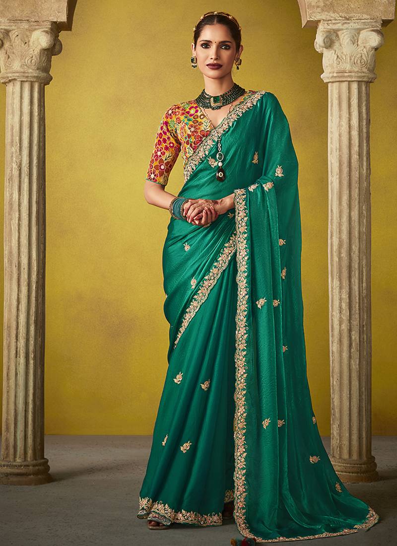 Green pure based fancy fabric embroidery saree