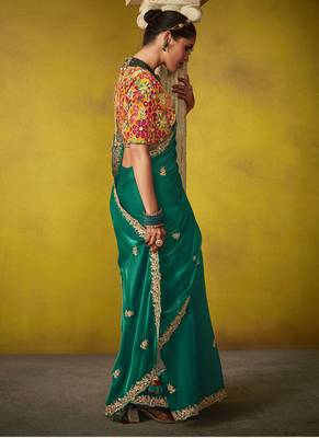Green pure based fancy fabric embroidery saree 2