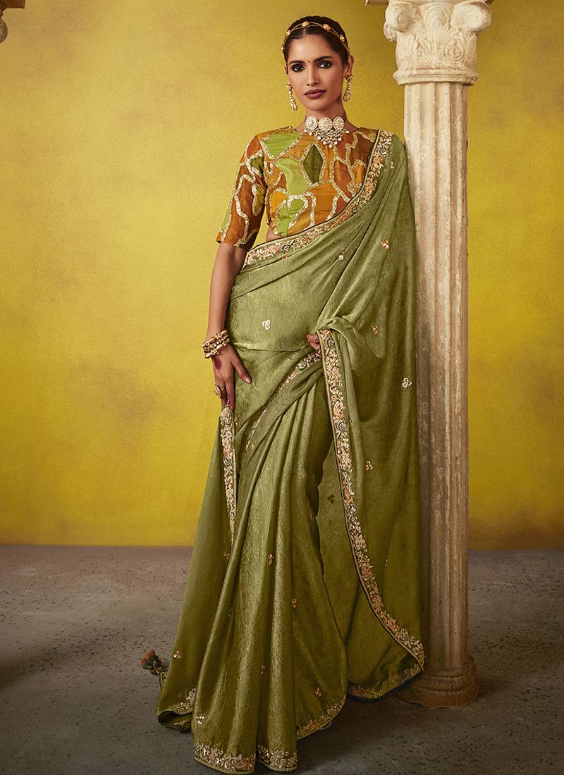 Olive pure based fancy fabric embroidery saree