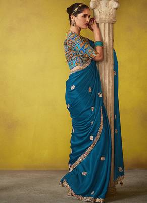 Teal pure based fancy fabric embroidery saree 2
