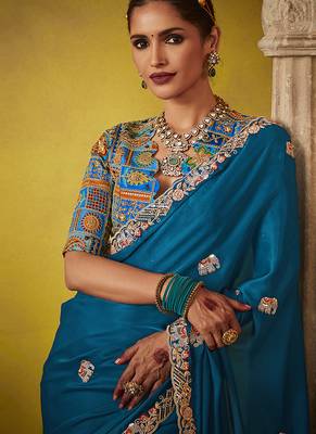 Teal pure based fancy fabric embroidery saree 4