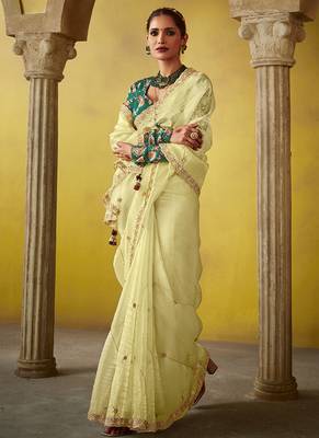 Cream pure based fancy fabric embroidery saree 2