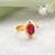 Gold plated ruby red pearl halo ring