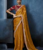 orange pure based fancy fabric embroidery saree