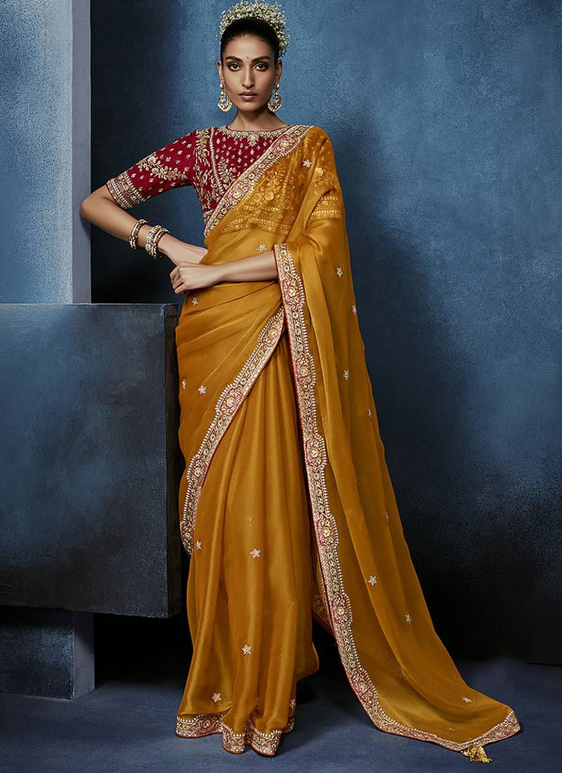 orange pure based fancy fabric embroidery saree