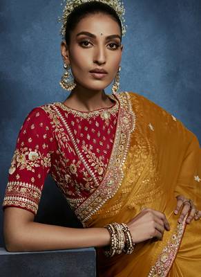 orange pure based fancy fabric embroidery saree 2