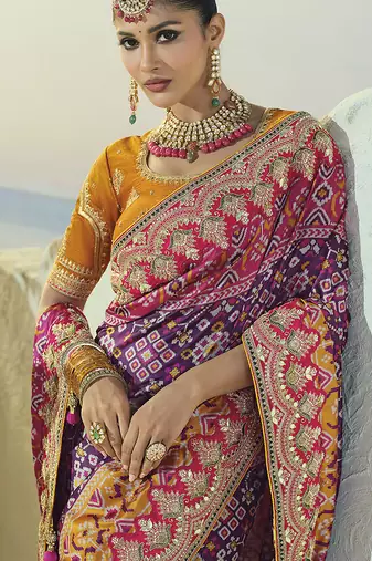purple pure patan patola silk blend saree in heavy hand work mirror cut dana & moti design