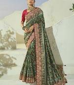 green pure patan patola silk blend saree with heavy handwork