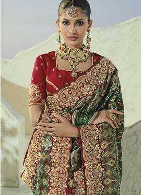 green pure patan patola silk blend saree with heavy handwork 3