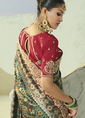 green pure patan patola silk blend saree with heavy handwork 4