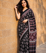 Black ajrakh print with mirror and latkan japan satin saree