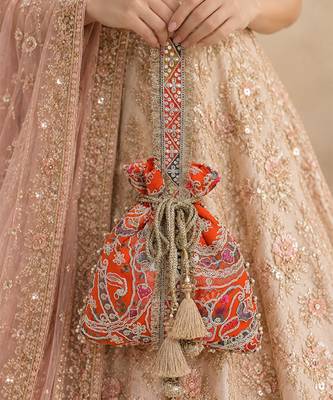 Orange gold silk potli bag 1