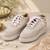 White synthetic beaded casual shoes