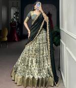 Women's Tussar Silk Floral Kalamkari Printed Lehenga Choli with Embroidered Border Dupatta