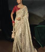 cream kanjivaram saree with jari thread moti cut dana and moti heavy hand work