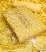 yellow & silver-toned embroidered unstitched dress material