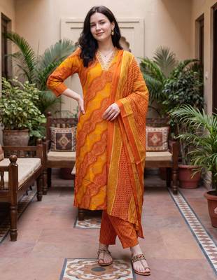 Orange printed cotton blend kurta trouser dupatta set 1