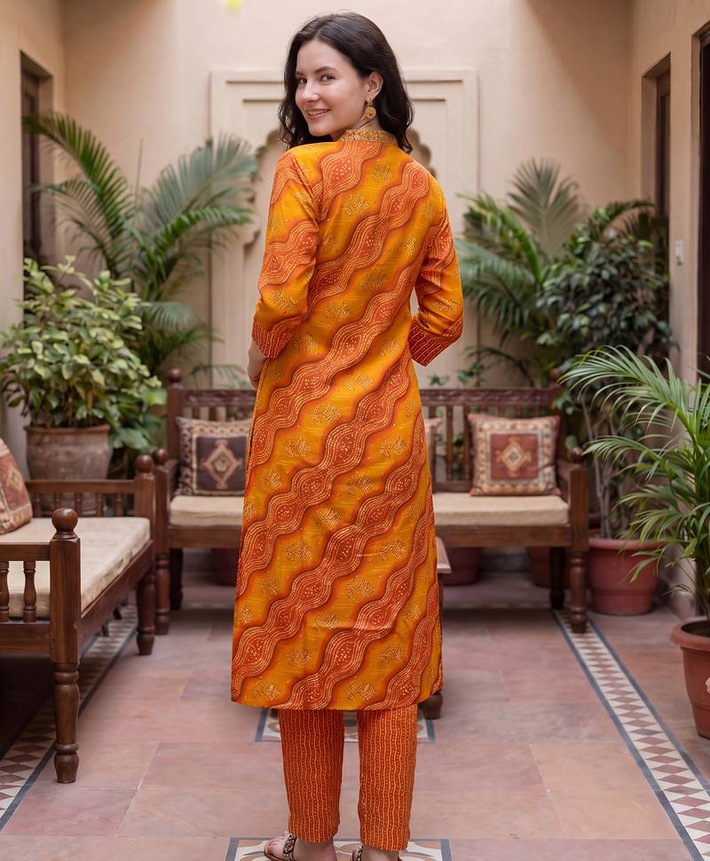 Orange printed cotton blend kurta trouser dupatta set