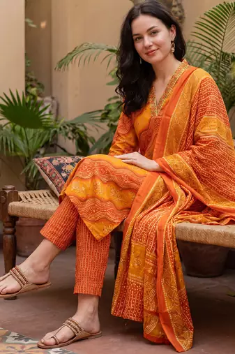 Orange printed cotton blend kurta trouser dupatta set