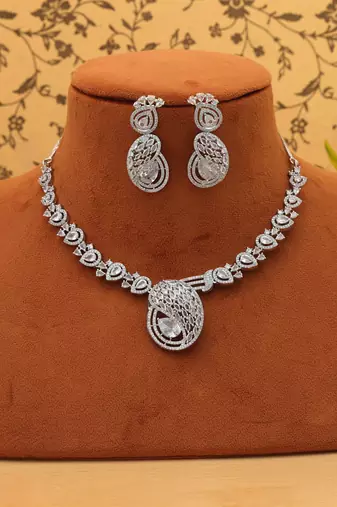 Sleek metallic silver color american diamond necklace set designed for formal partywear