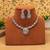 Sleek metallic silver color american diamond necklace set designed for formal partywear