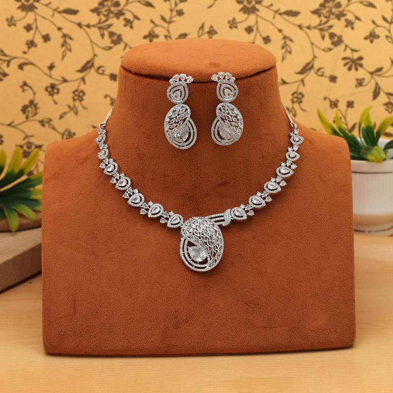 Sleek metallic silver color american diamond necklace set designed for formal partywear