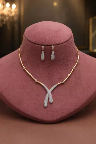 Crystal clear white color american diamond necklace set styled for evening functions