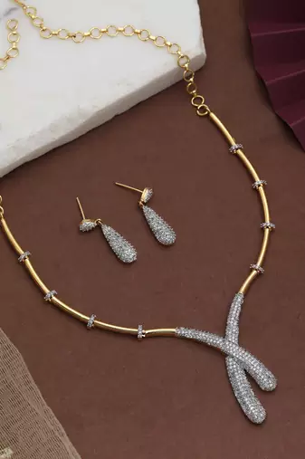 Crystal clear white color american diamond necklace set styled for evening functions