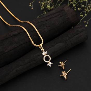 Radiant sheen gold color american diamond pendant set designed for evening celebrations 1