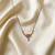 Soft powder light pink color fashion necklace created for delicate daily wear